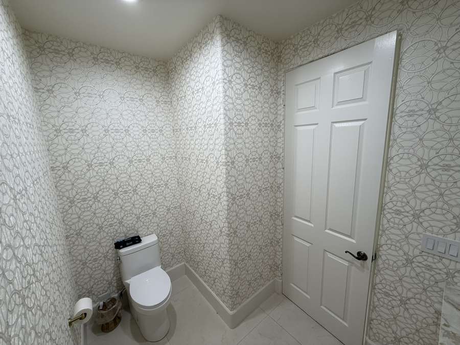Geometric print aligned across bathroom walls
